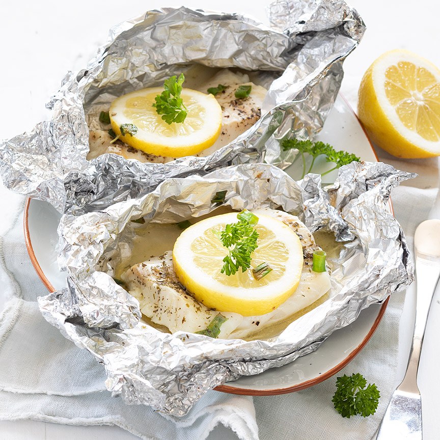 Fish packages with lemon from the barbecue