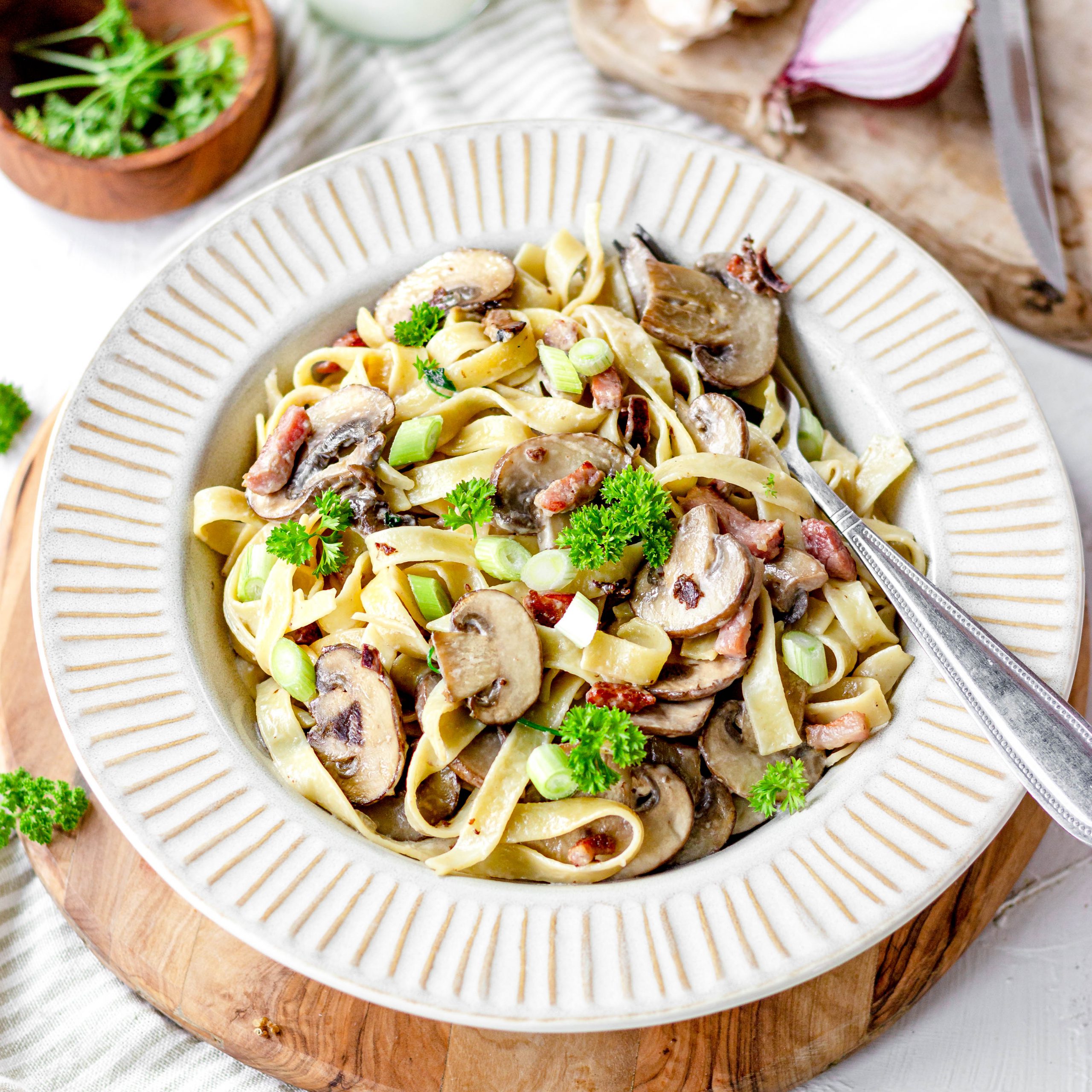 Lactose-free pasta with cream and mushrooms